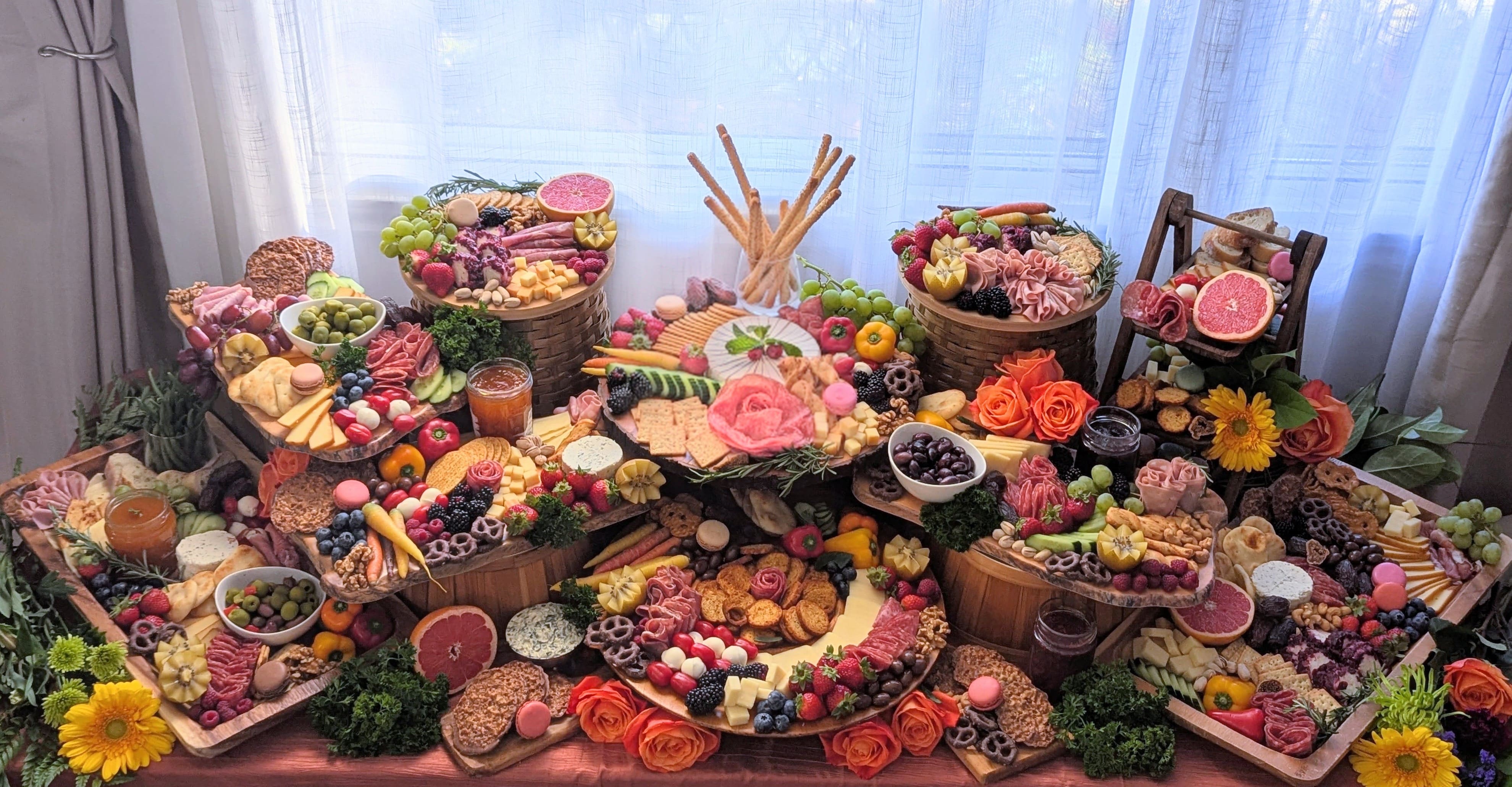 Opulent grazing table overflowing with produce and delicacies